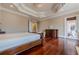 Bright bedroom with hardwood floors and access to patio at 3133 Saint Ives Country Club Pkwy, Johns Creek, GA 30097