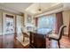Home office with built-ins, fireplace, and hardwood floors at 3133 Saint Ives Country Club Pkwy, Johns Creek, GA 30097