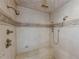 Large walk-in shower with multiple shower heads and a built-in seat at 3133 Saint Ives Country Club Pkwy, Johns Creek, GA 30097