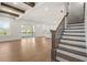 Open staircase with wood railing and hardwood floors at 2711 Twisted Oak Ln, Marietta, GA 30066