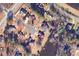 Aerial view of the property showcasing its location in a neighborhood with lake access at 3240 Somerset Se Ct, Conyers, GA 30013