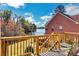 Backyard deck overlooking a lake with mature trees and sky at 3240 Somerset Se Ct, Conyers, GA 30013