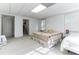 White Bedroom featuring neutral carpet, closet, twin beds and small AC window unit at 3240 Somerset Se Ct, Conyers, GA 30013