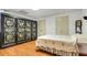 Inviting bedroom with an accent folding screen and light wood flooring at 3240 Somerset Se Ct, Conyers, GA 30013