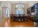 Formal dining room with hardwood floors, chandelier, wainscoting, and a large window with great natural light at 3240 Somerset Se Ct, Conyers, GA 30013