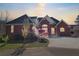 Charming brick home featuring an attached garage, lush landscaping, and a welcoming driveway at 3240 Somerset Se Ct, Conyers, GA 30013