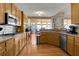 Well-equipped kitchen featuring stainless steel appliances, hardwood floors, and a breakfast bar at 3240 Somerset Se Ct, Conyers, GA 30013