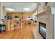 Open-concept kitchen featuring wood cabinets, a breakfast bar, hardwood floors, and modern appliances at 3240 Somerset Se Ct, Conyers, GA 30013