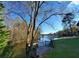 Picturesque view of the lake and trees from the backyard deck, offering a serene ambiance at 3240 Somerset Se Ct, Conyers, GA 30013