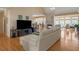 Spacious living room featuring a fireplace, hardwood floors, and large windows offering plenty of natural light at 3240 Somerset Se Ct, Conyers, GA 30013