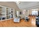 Inviting living room featuring custom built-ins, hardwood floors, and a comfortable seating area at 3240 Somerset Se Ct, Conyers, GA 30013