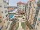 Community aerial view showcasing pool, landscaping, multiple-story buildings and parking lot at 230 E Ponce De Leon Ave # 210, Decatur, GA 30030