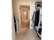 View through a doorway into a walk-in closet and bathroom featuring ample storage with view of tiled shower at 230 E Ponce De Leon Ave # 210, Decatur, GA 30030