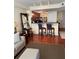 Open-concept living area with a breakfast bar, wood floors, and views into the kitchen at 230 E Ponce De Leon Ave # 210, Decatur, GA 30030