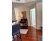 Stylish living area featuring hardwood floors, a small desk, and a glimpse of a bright white door at 230 E Ponce De Leon Ave # 210, Decatur, GA 30030