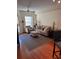 Inviting living room features neutral palette, ceiling fan, and an adjacent balcony door for natural light at 230 E Ponce De Leon Ave # 210, Decatur, GA 30030