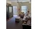 Bright living room with a ceiling fan, neutral color palette, and access to a balcony at 230 E Ponce De Leon Ave # 210, Decatur, GA 30030