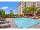 Refreshing community pool with plenty of lounge chairs at 230 E Ponce De Leon Ave # 210, Decatur, GA 30030