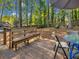 Wooden deck with seating area, nestled in a wooded backyard at 3004 Hidden Lake Dr, Duluth, GA 30096