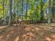 Backyard with wooden swing set and fire pit area at 3004 Hidden Lake Dr, Duluth, GA 30096