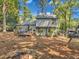 View of home's back and side yard with deck and fire pit at 3004 Hidden Lake Dr, Duluth, GA 30096