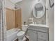 Bathroom with a gray vanity and a brown tiled shower at 3004 Hidden Lake Dr, Duluth, GA 30096