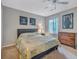 Spacious bedroom with carpeted floors, a large bed, and plenty of closet space at 3004 Hidden Lake Dr, Duluth, GA 30096