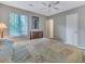 Comfortable bedroom with carpeted floors, ceiling fan, and ample closet space at 3004 Hidden Lake Dr, Duluth, GA 30096
