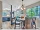 Bright dining area with a glass-top table and chairs, adjacent to the kitchen at 3004 Hidden Lake Dr, Duluth, GA 30096