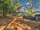 Exterior view of home with wooded backyard and chain link fence at 3004 Hidden Lake Dr, Duluth, GA 30096