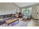 Relaxing living room with hardwood floors, ample seating, and large windows at 3004 Hidden Lake Dr, Duluth, GA 30096