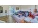 Cozy living room featuring hardwood floors, comfortable seating, and access to a patio at 3004 Hidden Lake Dr, Duluth, GA 30096