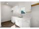 Modern kitchen with white shaker cabinets and quartz countertops at 1088 Wedgewood Nw Dr, Atlanta, GA 30318