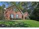 Brick house with a large front yard and lush landscaping at 710 Stonehenge Pl, Jonesboro, GA 30236