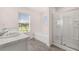 Bathroom boasts a bathtub, shower, and marble countertop at 4107 Spencer Trl, Stonecrest, GA 30038