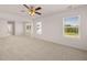 Bright bedroom with ceiling fan and neutral carpeting at 4107 Spencer Trl, Stonecrest, GA 30038