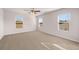 Large bedroom with plush carpeting and multiple windows at 4107 Spencer Trl, Stonecrest, GA 30038