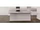 Kitchen island with granite countertop and sink at 4107 Spencer Trl, Stonecrest, GA 30038