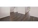 Hardwood floor living room with views of kitchen and stairs at 4107 Spencer Trl, Stonecrest, GA 30038