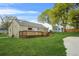 Green backyard with a wooden deck, great for leisure and enjoying the outdoor space at 1159 Fair Sw St, Atlanta, GA 30314