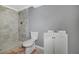 Bathroom with tiled shower, toilet and single sink vanity at 1159 Fair Sw St, Atlanta, GA 30314