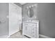 Bathroom with bright white cabinets, a modern vanity, and tiled floors at 1159 Fair Sw St, Atlanta, GA 30314