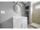 Bathroom featuring a modern vanity, sleek mirror, and open shelving at 1159 Fair Sw St, Atlanta, GA 30314