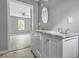 Bright bathroom with double vanity and marble countertop at 1159 Fair Sw St, Atlanta, GA 30314