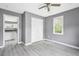 Bedroom with hardwood floors and open closet space at 1159 Fair Sw St, Atlanta, GA 30314