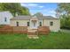 Charming single-story home with a wooden deck and well-maintained front yard at 1159 Fair Sw St, Atlanta, GA 30314