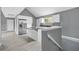 Bright kitchen features white cabinets, stainless steel fridge and modern gray color palette at 1159 Fair Sw St, Atlanta, GA 30314