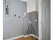 Laundry room with gray walls, overhead cabinet, and utility connections at 1159 Fair Sw St, Atlanta, GA 30314