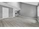 Spacious living room with modern floors leading into kitchen at 1159 Fair Sw St, Atlanta, GA 30314