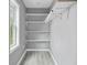 Walk-in pantry with gray plank flooring and bright white shelving at 1159 Fair Sw St, Atlanta, GA 30314